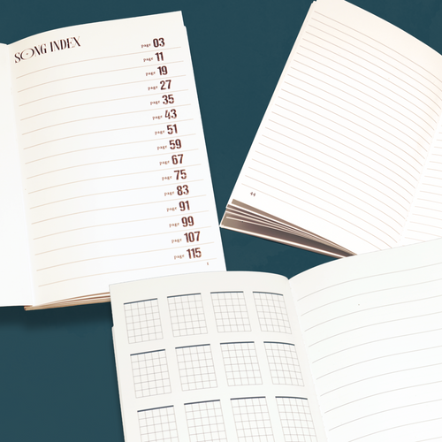 Open notebook with different page types on a teal background